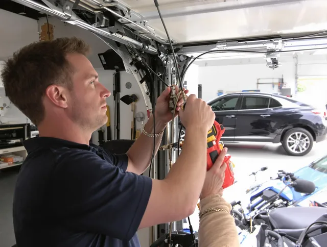 Montclair Garage Door Repair safety certified technician performing cable replacement in Montclair
